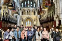 All of the members of the trip taking a group picture in a cathedral in Ireland
