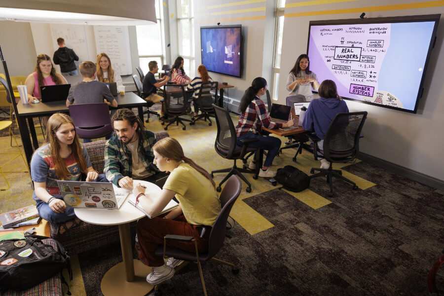 Students studying in a room.