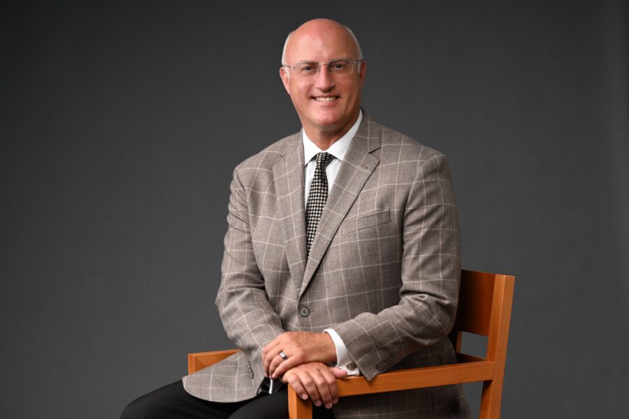 Gregg Chenoweth sitting in a chair