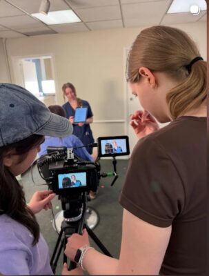 Ava behind the camera for a video shoot.