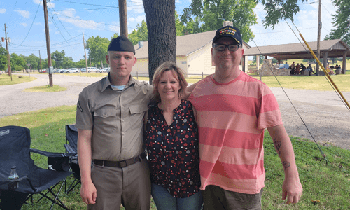 Nancy with her son and husband.