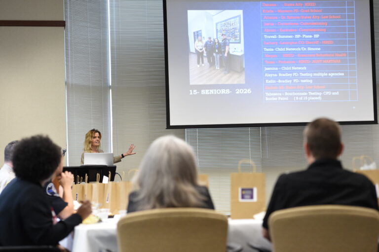 A picture of Dr. Stroud giving a presentation.