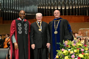 Duane receiving his award from Olivet. Dr Chenoweth and Dr. Chambo are standing on either side of Duane