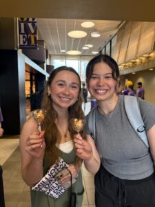 Two girls holding their cake pops at Olivet's day of giving.