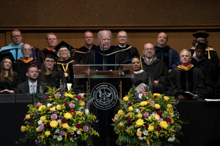 Picture of Ron talking on stage.