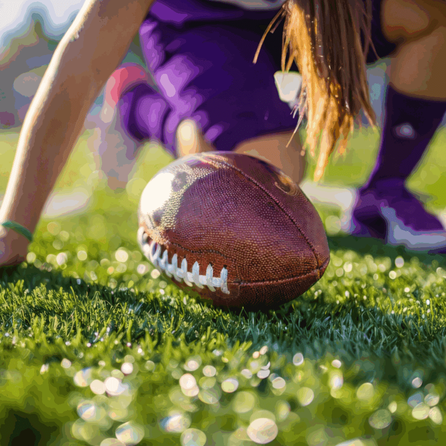 A picture of a girl playing flag football.