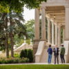 Dr. Kent Olney talking with two students in front of Burke