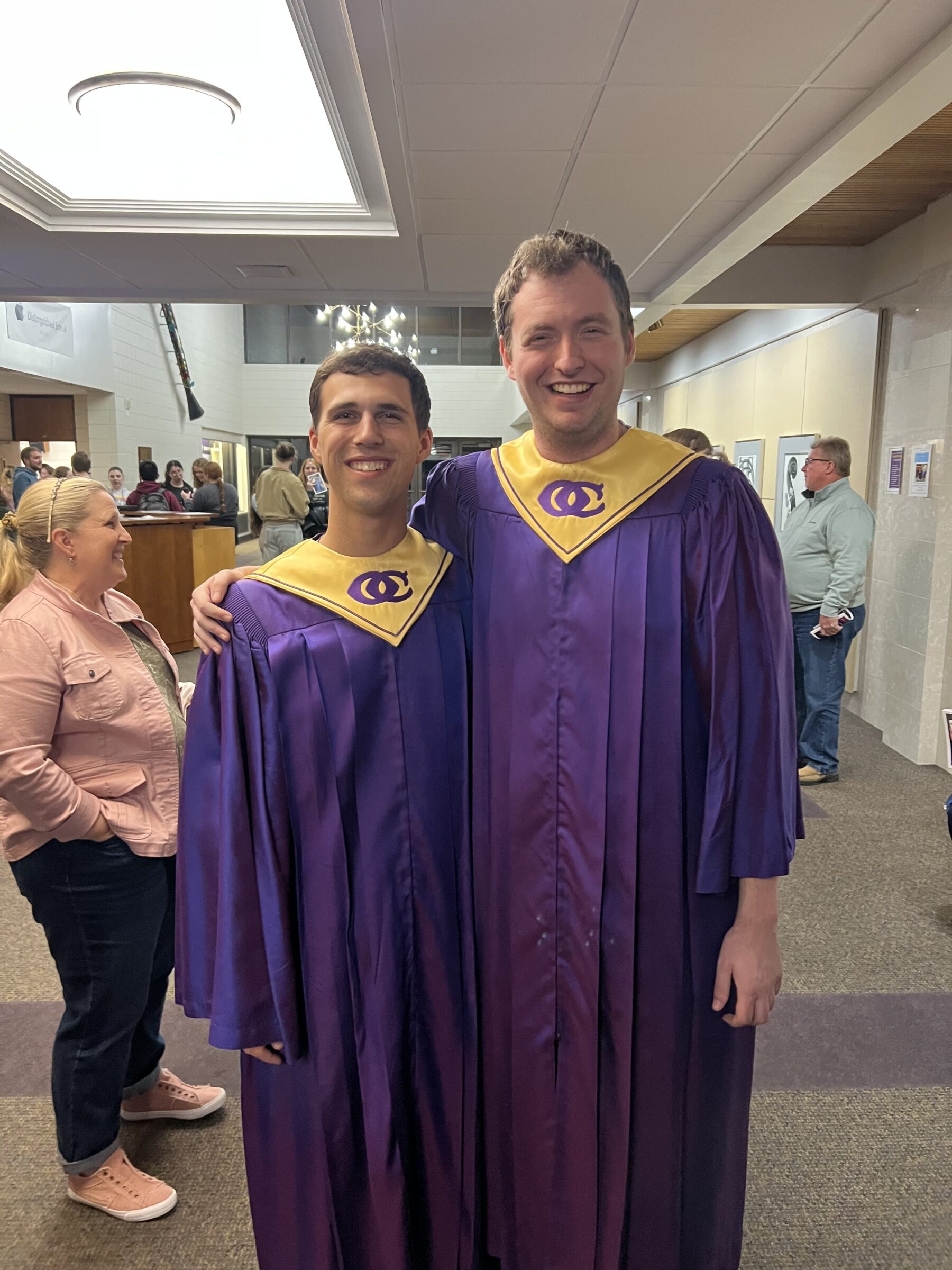 A picture of cole in his Choir robe with someone standing next to him in his choir robe.