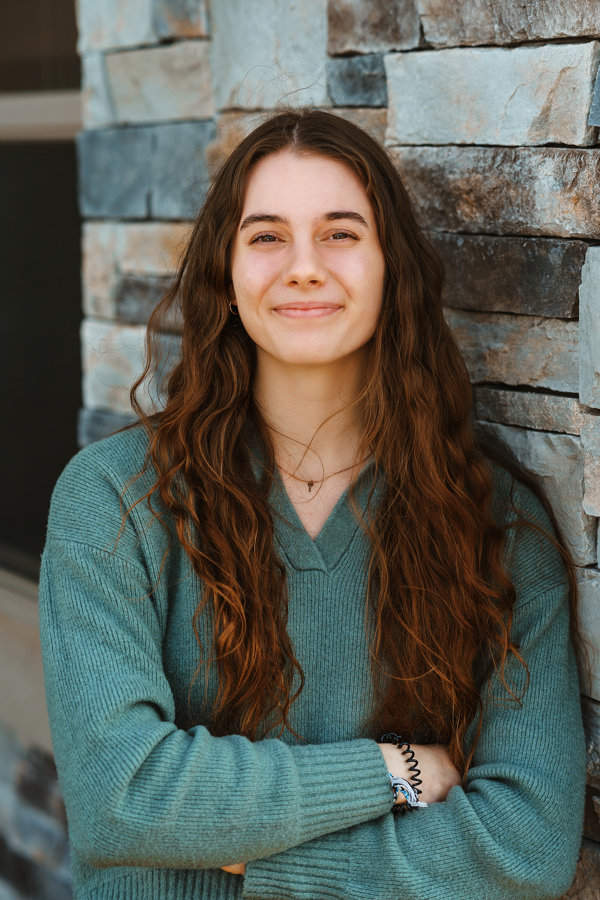 A professional headshot of Mia