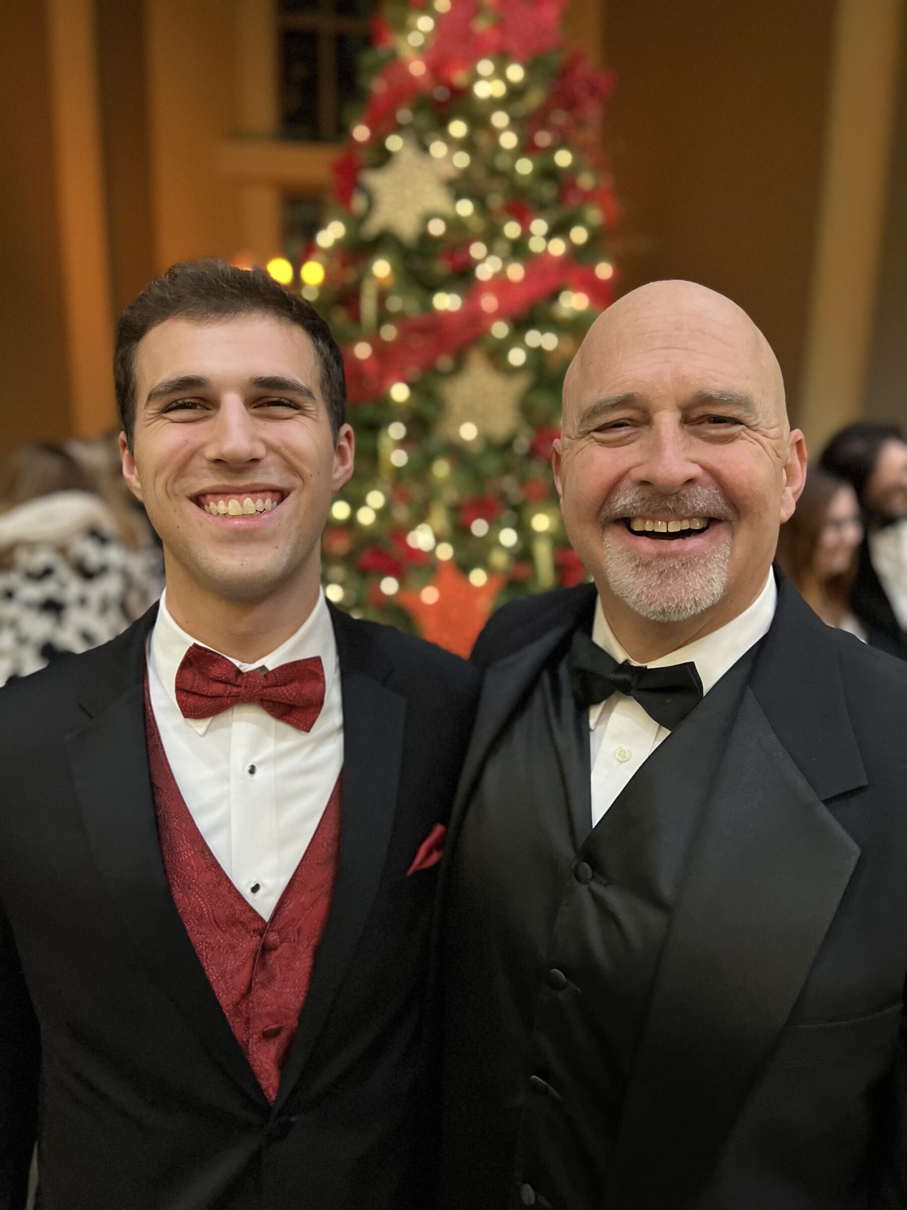 A picture of Cole and a professor after Sounds of the Season.