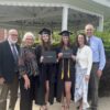 Mia with her sister, parents and grandparents after graduating.