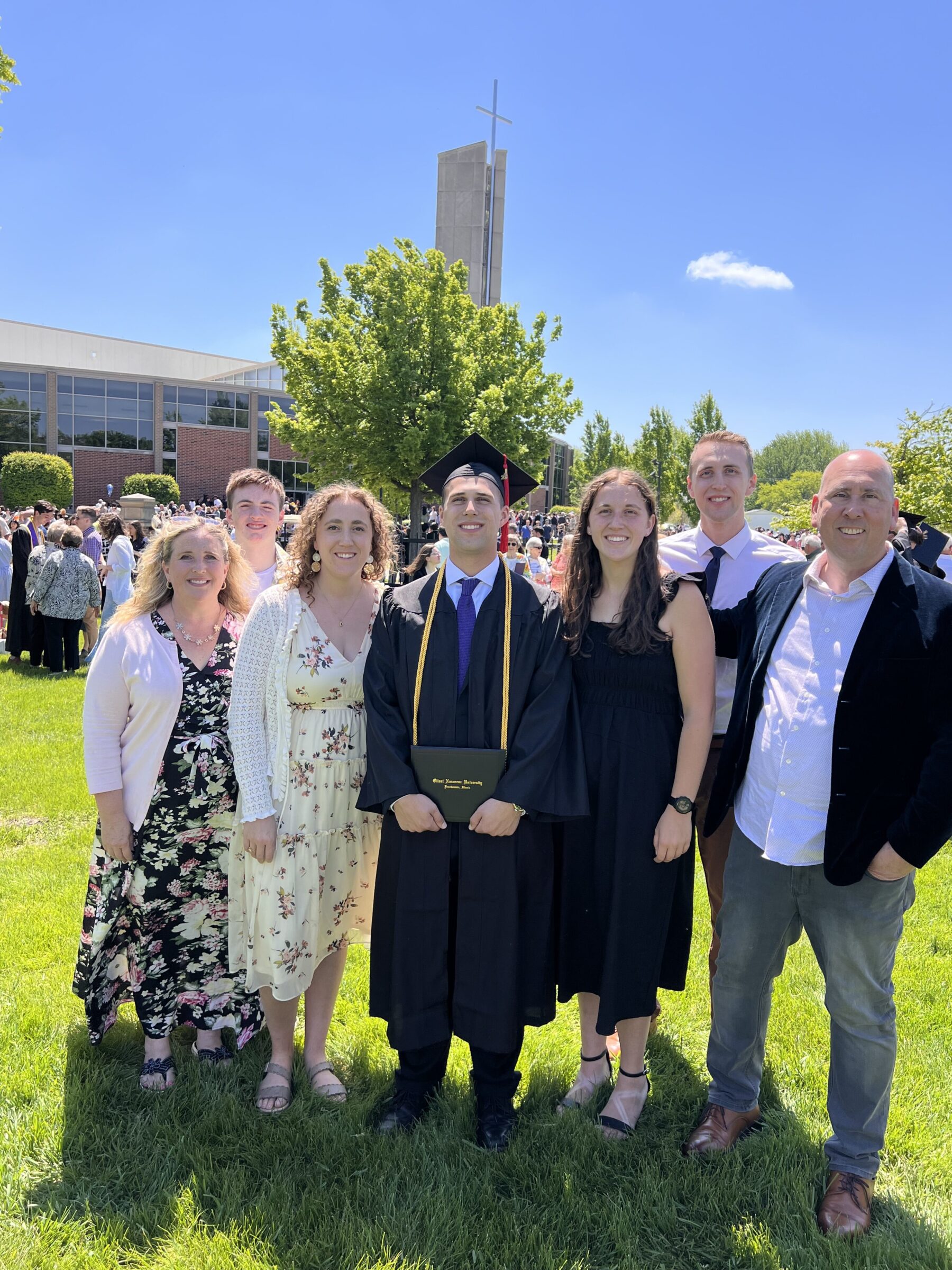 A picture of Cole and his family after his graduation ceremony.
