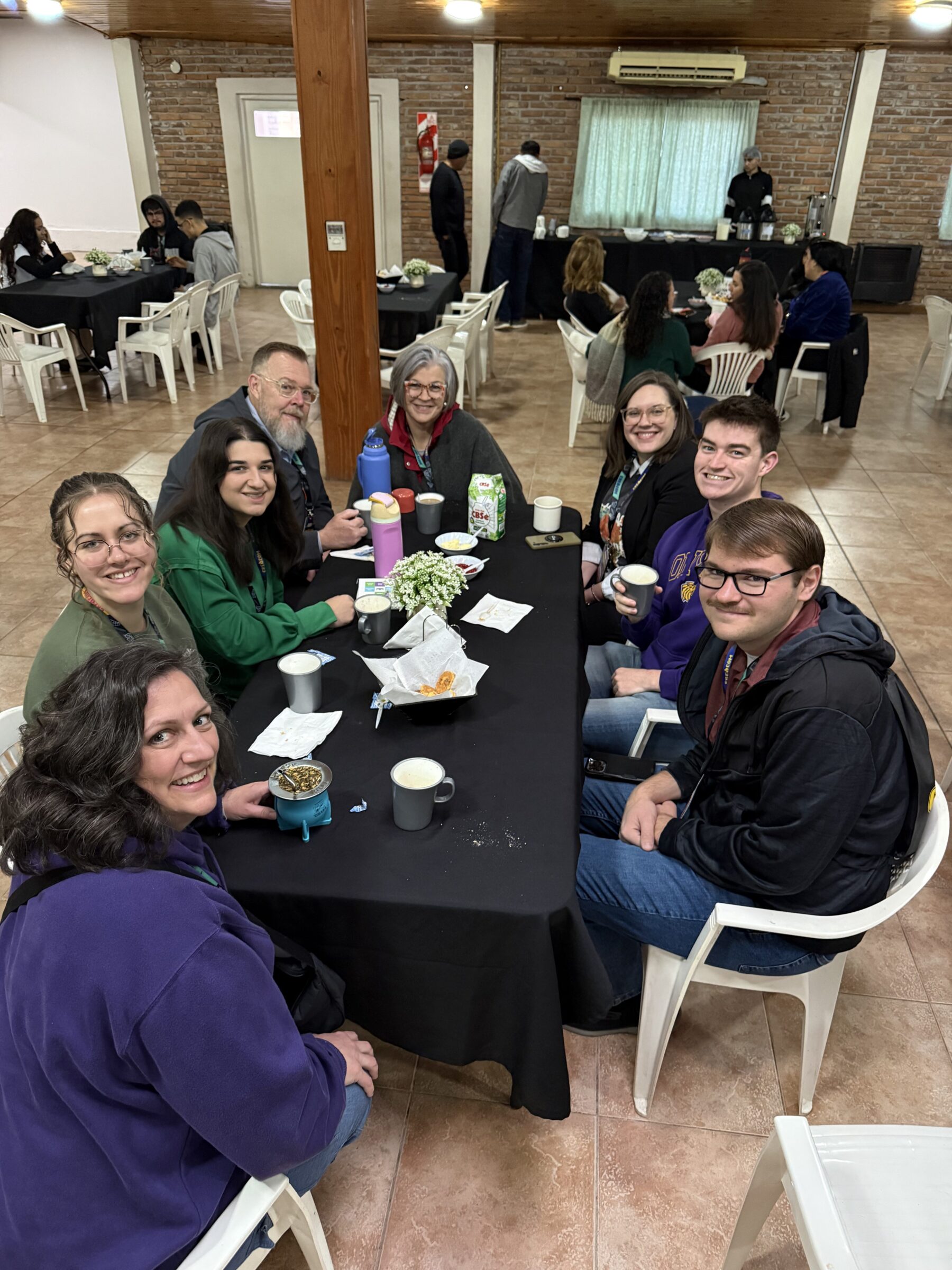 A picture of the group sitting at a table in Argentina.