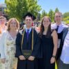 A picture of Cole and his family after graduation.