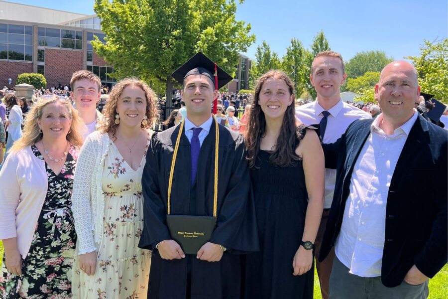 A picture of Cole and his family after graduation.