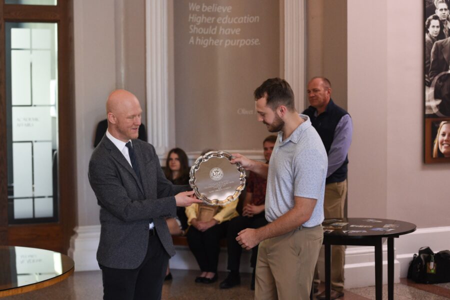 A picture of Nicholas receiving his award
