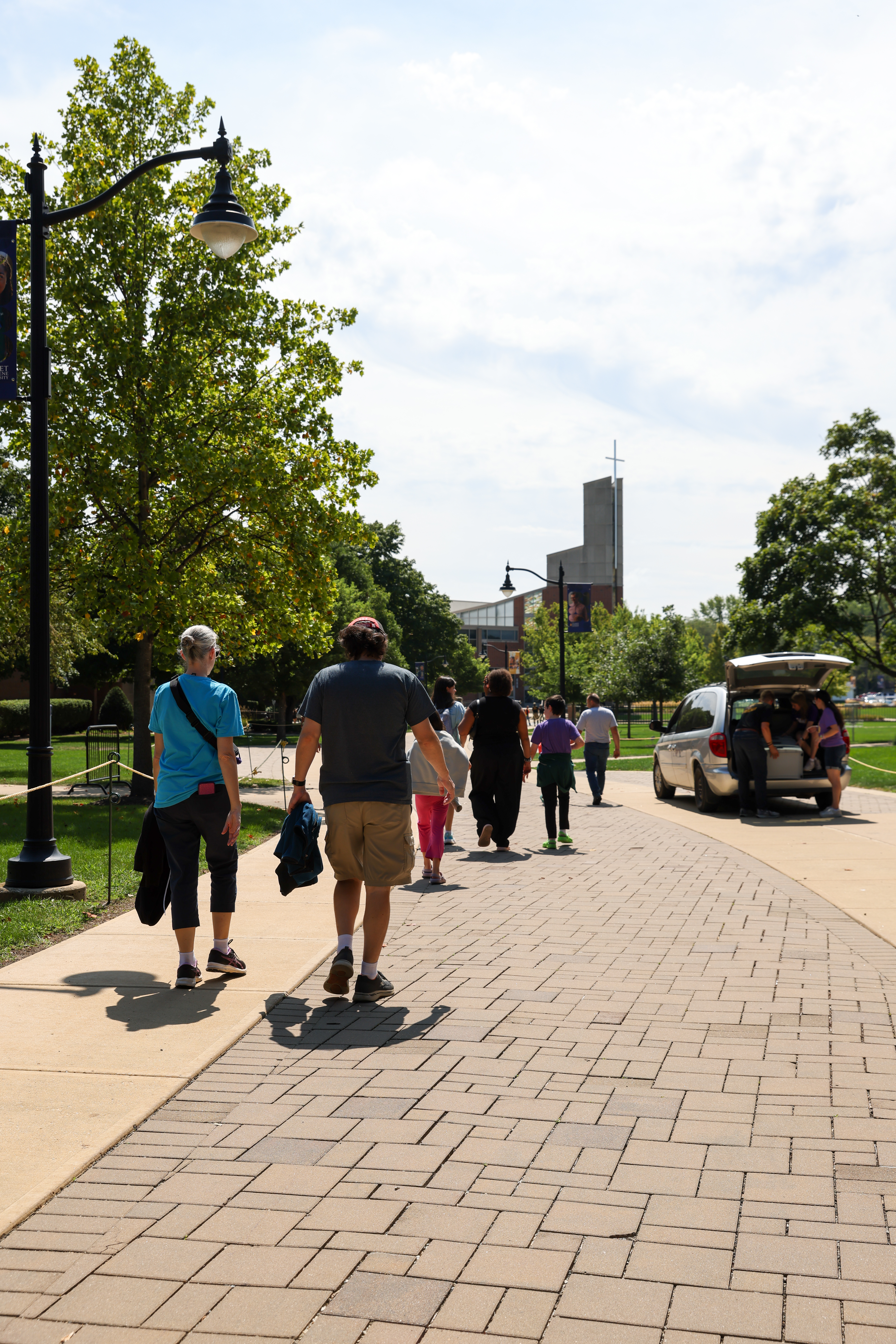A picture of students being moved into their dorms.