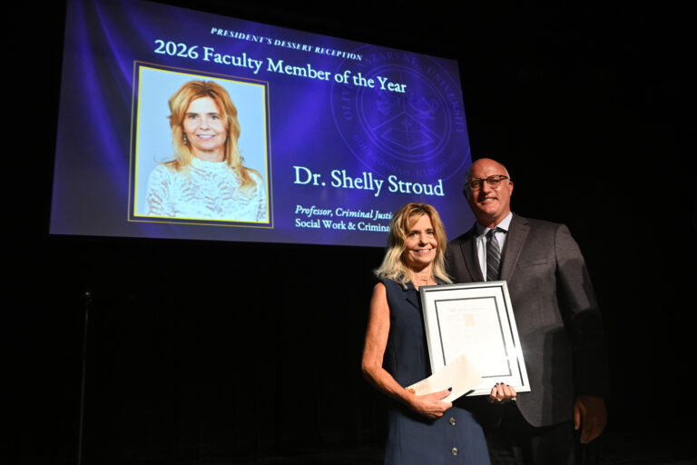 A picture of Dr. Stroud receiving her award from Dr. Chenoweth.